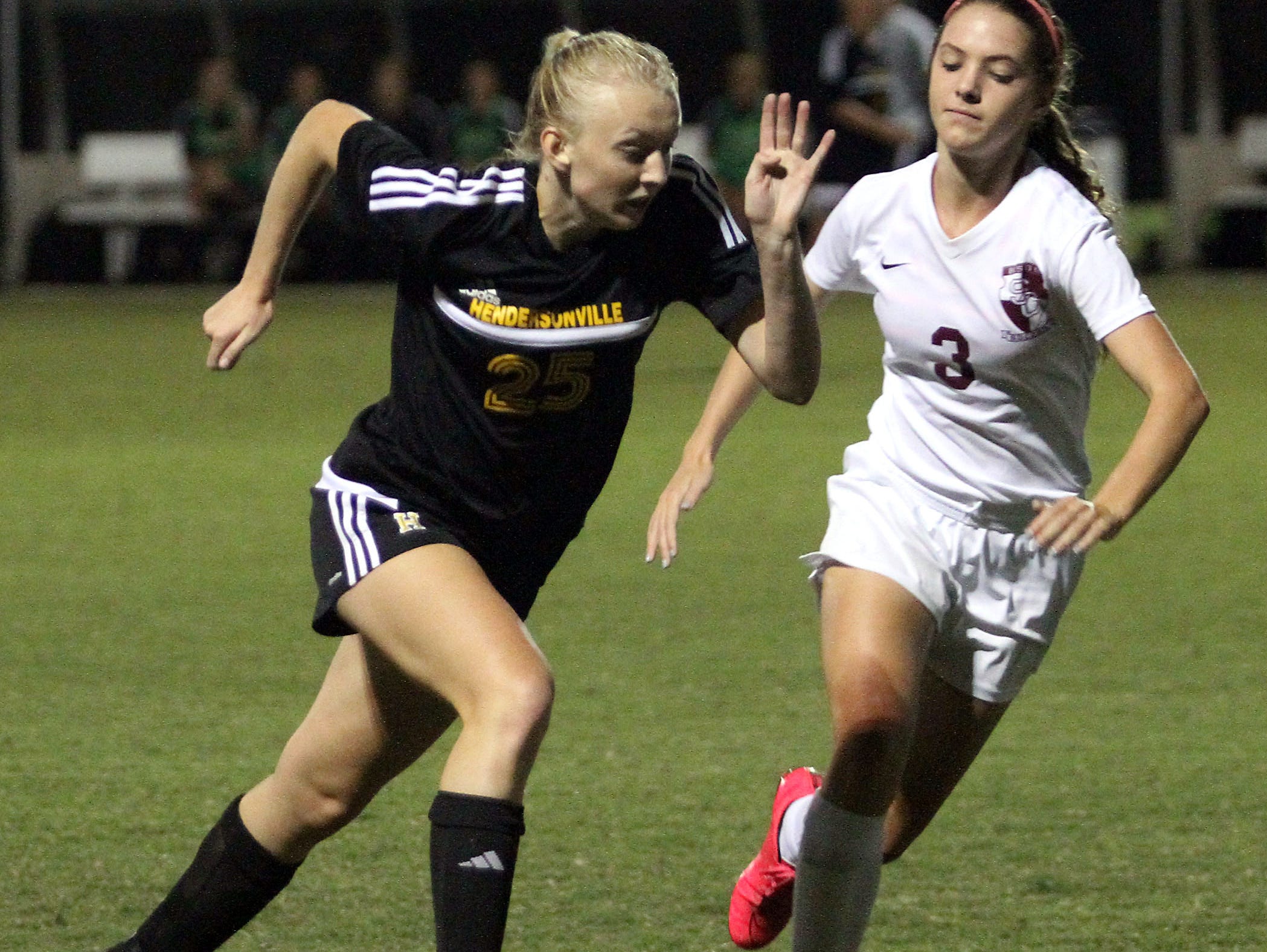 Hendersonville High junior Sydney Cason (left)