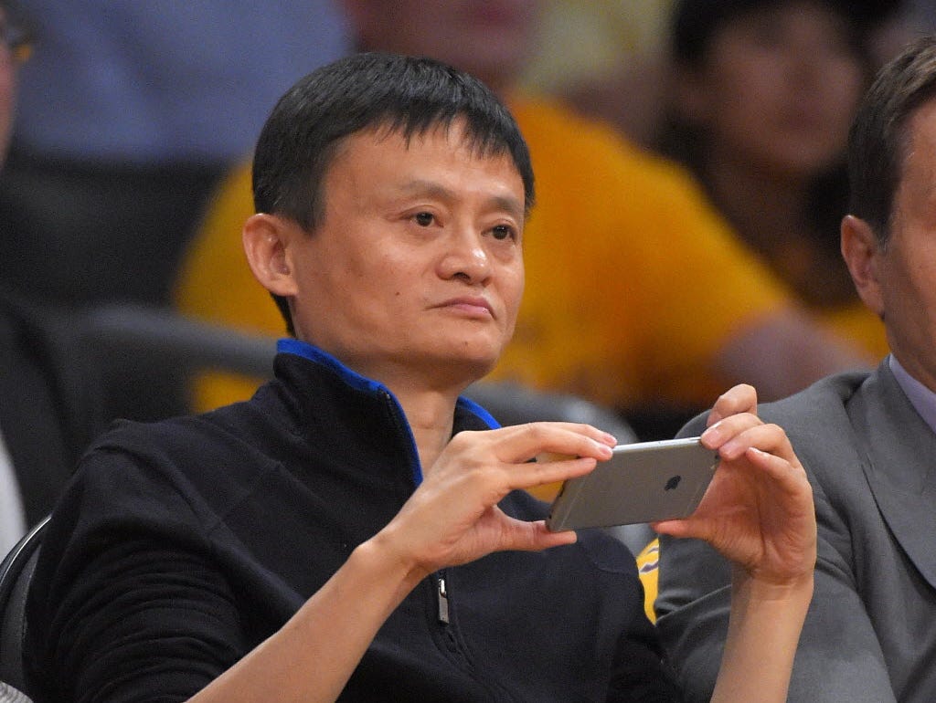 Jack Ma, executive chairman of Alibaba Group, watches the Los Angeles Lakers play the Houston Rockets during the first half of an NBA basketball game, Tuesday, Oct. 28, 2014, in Los Angeles.