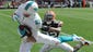 Miami Dolphins wide receiver Brian Hartline (82) grabs a 34-yd touchdown pass ahead of the defense of Cleveland Browns cornerback Buster Skrine (22) during the third quarter at FirstEnergy Stadium.