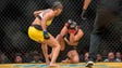 Amanda Nunes punches Miesha Tate during their bantamweight