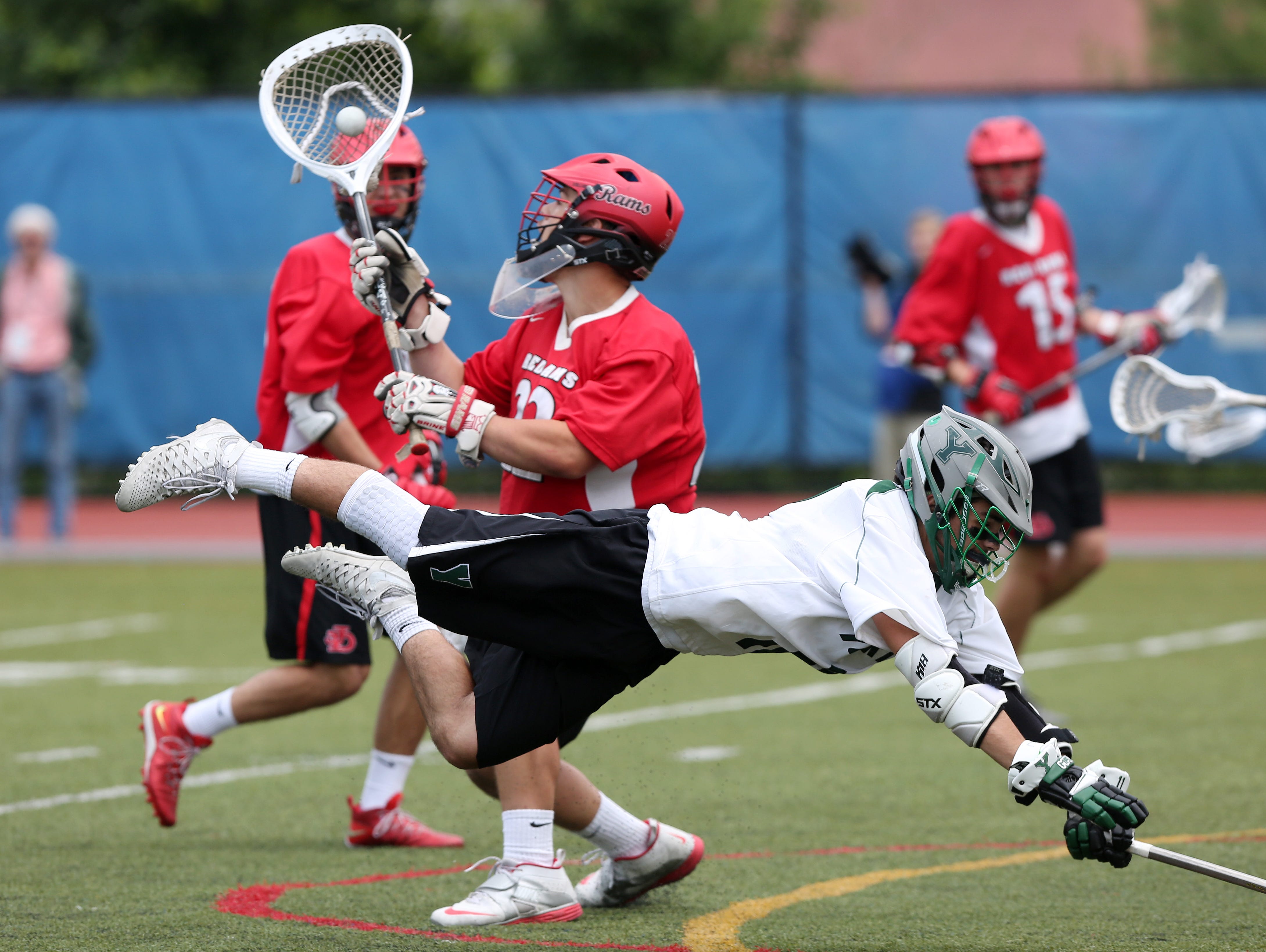 Jamesville-Dewitt goalie Dylan Fleischmann (22) stops a shot from Yorktown's Thomas Donatelli (11) during the NYSPHSAA Class B championship lacrosse game at Middletown High School June 11, 2016. Jamesville-Dewitt won the game 9-6.