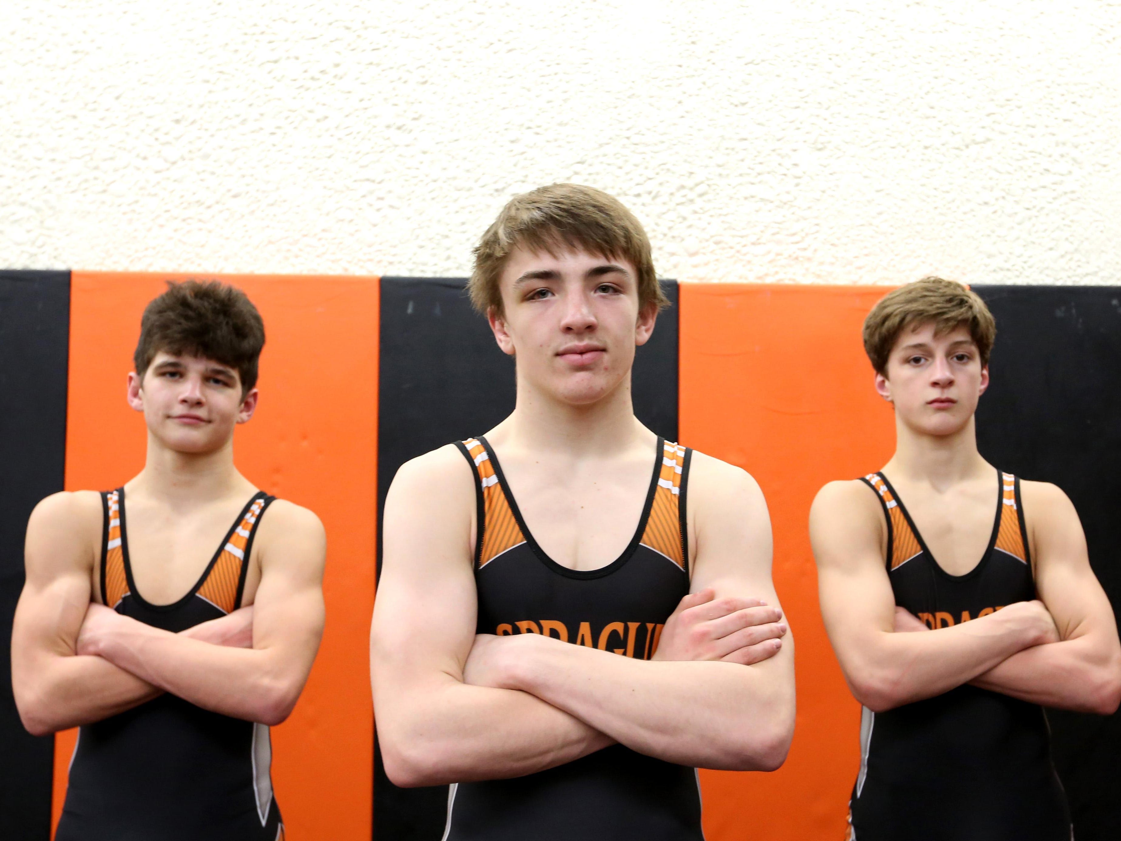 Sprague wrestlers Evan Spragg, left, Michael Murphy and Daniel McClung during practice Thursday, Jan. 28, 2016, in Salem, Ore.