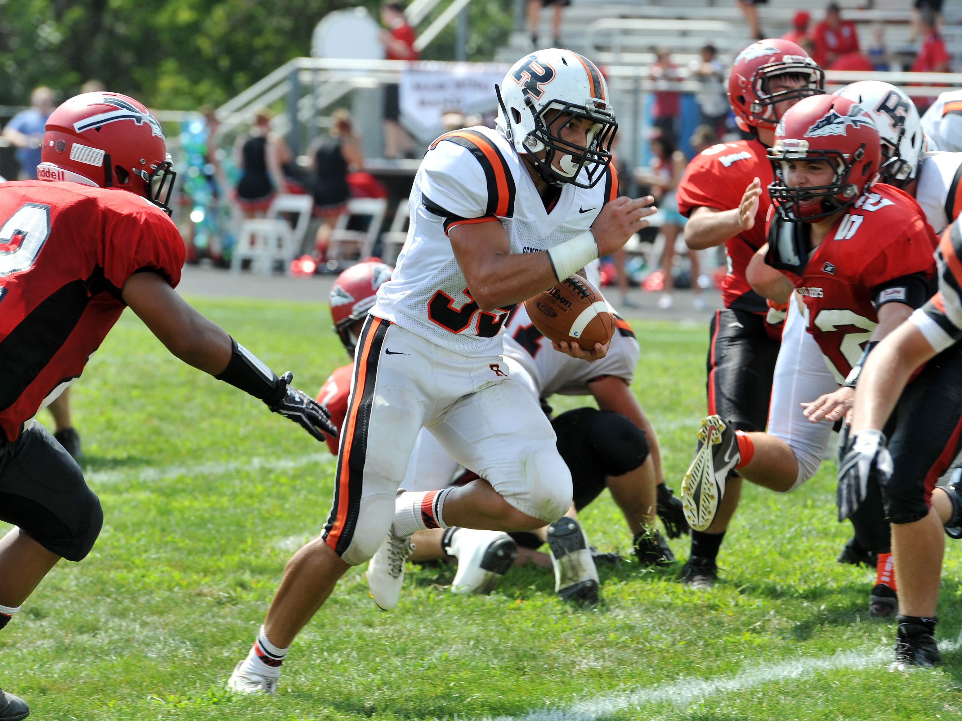 Ridgewood's Zach Donley runs through a gap on his way to the end zone against Bellaire Aug. 30.