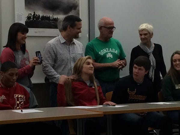 Maegan O'Neill (center) with family, will play soccer at Washington State University.