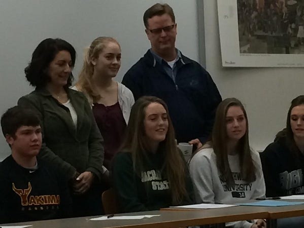 Caitlin Prothe (center) posing with family. She will play soccer at Sacramento State University.