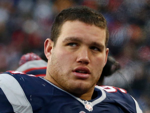 New England Patriots defensive tackle Chris Jones stands on the sideline in the fourth quarter of an NFL football game against the Cleveland Browns Sunday, Dec. 8, 2013, in Foxborough, Mass. The Patriots came from behind to win 27-26. (AP Photo/Elise Amendola)