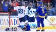 Team Europe forward Tomas Tatar (21) is mobbed by teammates