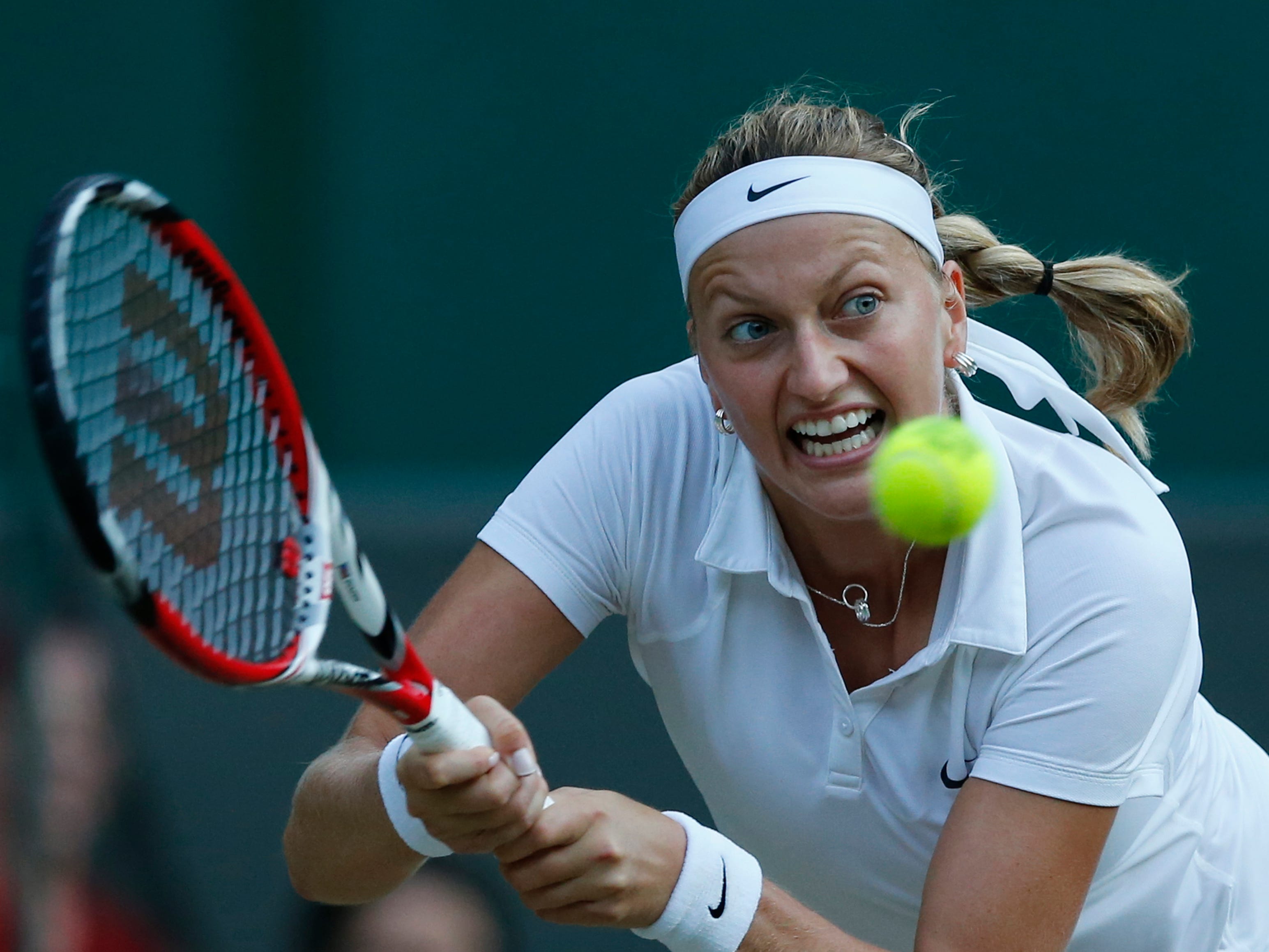 Petra Kvitova of the Czech Republic returns to Barbora Zahlavova Strycova of the Czech Republic during their women's quarterfinal match in Wimbledon on July 1.