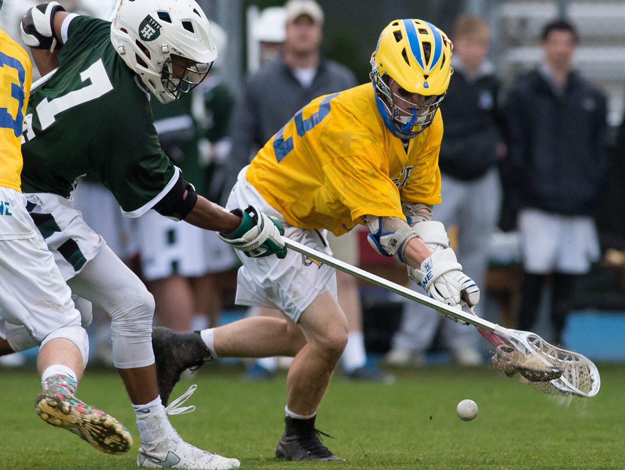 Tower Hill's Kevin Turner (7), left and Caesar Rodney's Brinen Lefevre (12) battle for a loose ball.