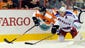 Philadelphia Flyers center Chris Vande Velde (76) and New York Rangers defenseman Ryan McDonagh (27) battle for puck along the boards in the first period at the Wells Fargo Center.