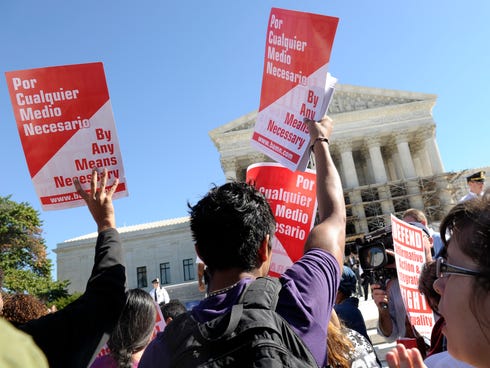 Proponents of affirmative action demonstrate outside the Supreme Court during oral arguments in October 2013.