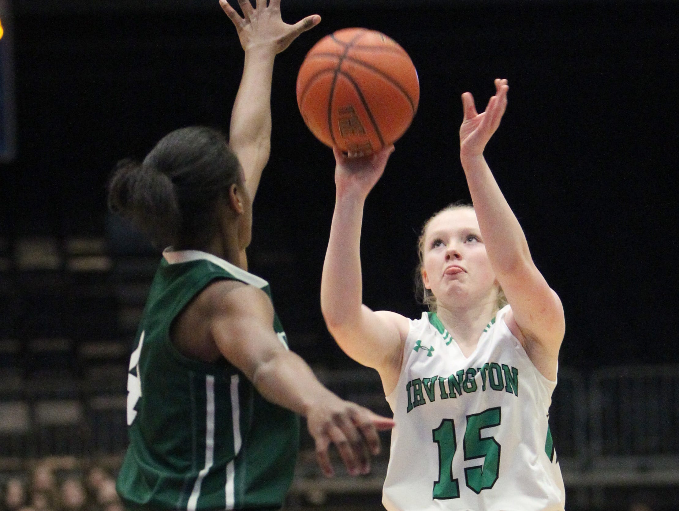 Irvington's Lindsay Halpin shoots over Woodlands' Teisha Hyman during the Class B final at the Westchester County Center Feb. 29, 2016. Irvington won 77-68.