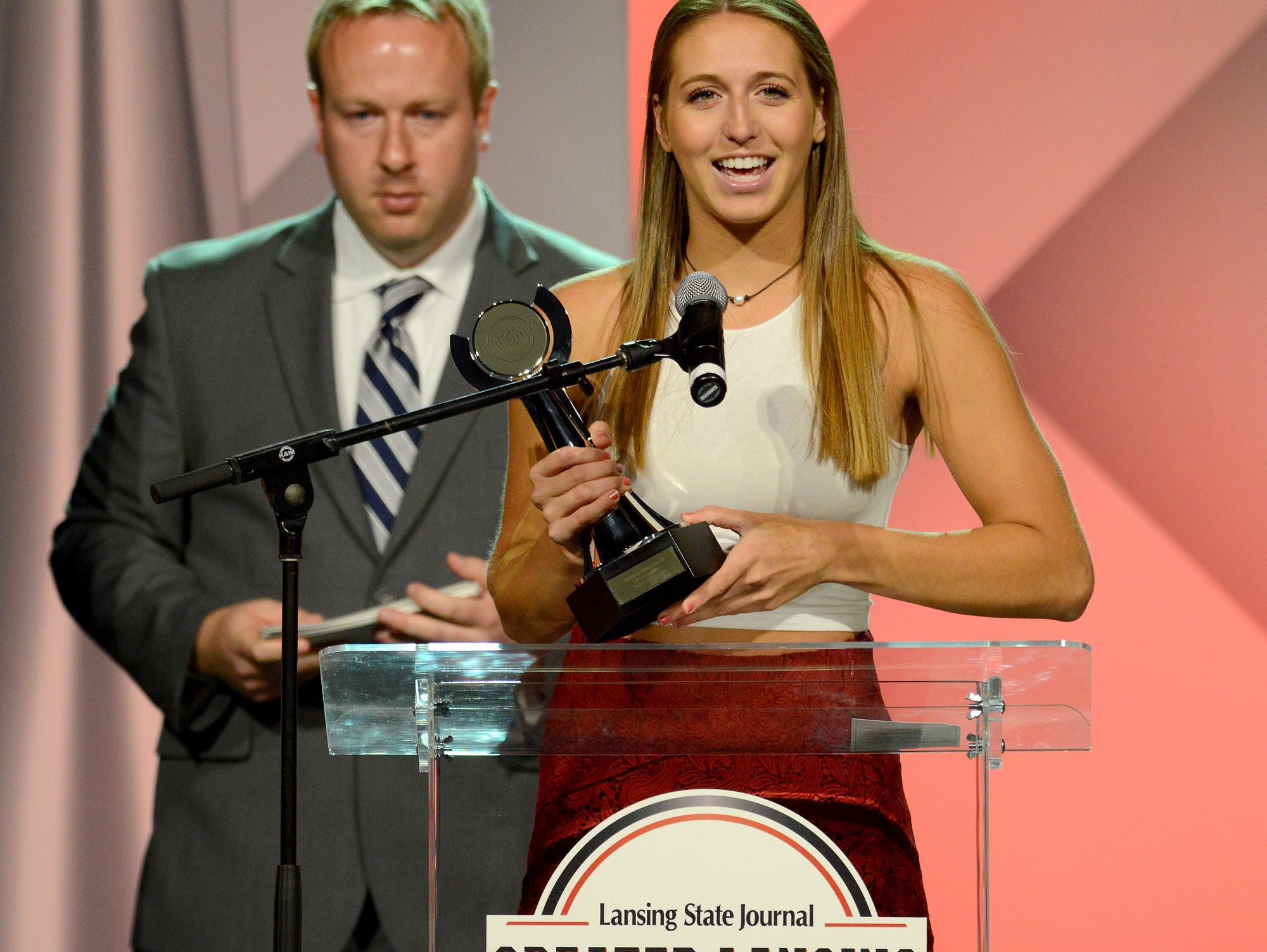 Angela Palmer, of Okemos, accepts the award for Girls Lacrosse Player of the Year at the Lansing State Journal's Greater Lansing Sports Awards Show show Tuesday, June 7, 2016 at the Lansing Center.