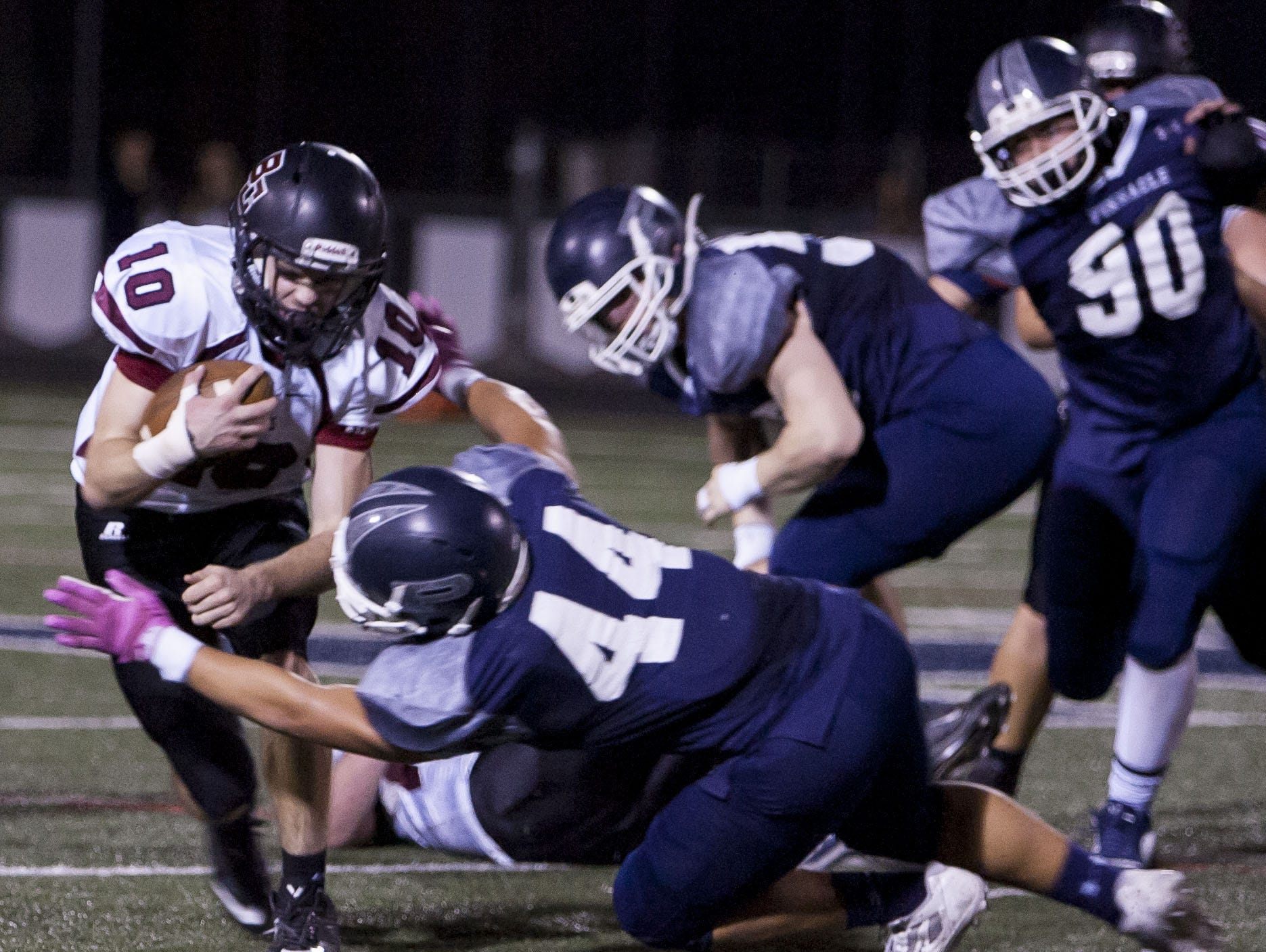 Boulder Creek quarterback Gunther Johnson is tackled during a game against Pinnacle in October.