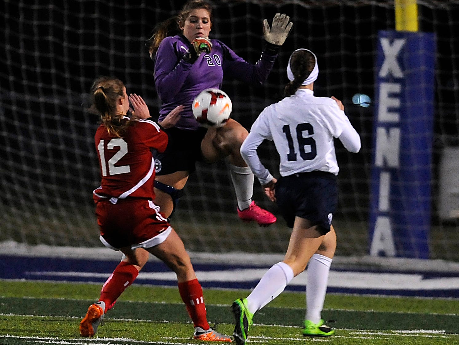 Granville goalkeeper Tori Long blocks a shot from Indian Hill Anna Podojil as defender Emily Kauchak recovers back. Long battled through injuries to help secure Granville's spot in the Division II State Championship with ten saves. They play number one Akron Hoban for the title Friday.