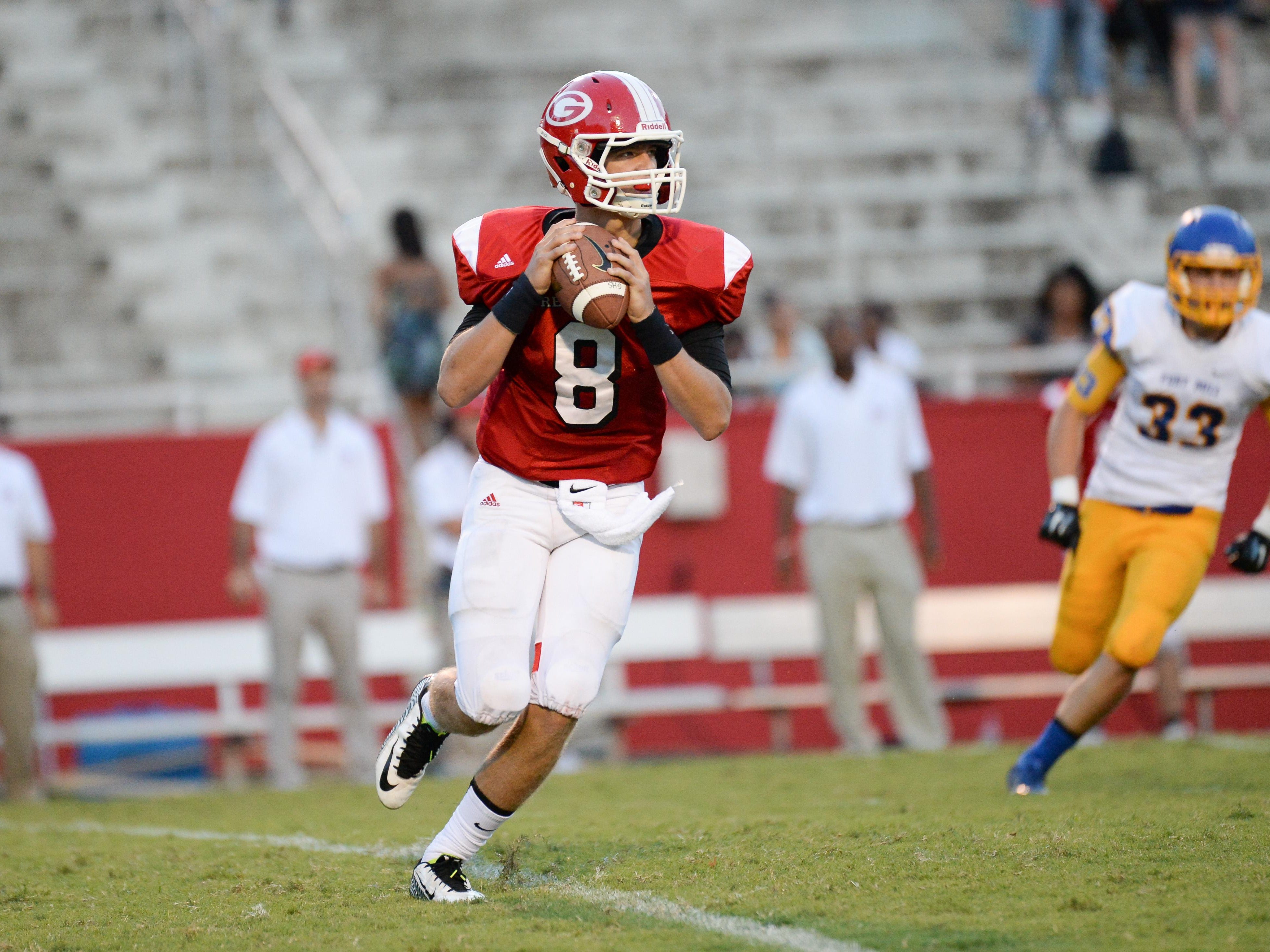 Greenville’s Carson Spiers (8) passed for 288 yards with three touchdowns against Fort Mill on Friday.