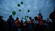 Mourners gather during a vigil for Lea Phann at the