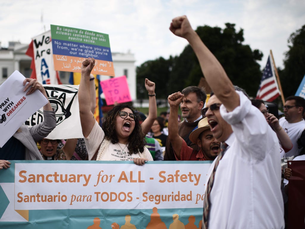 Immigrants and supporters demonstrate during a rally in support of the Deferred Action for Childhood Arrivals (DACA) in front of the White House on Sept. 5, 2017 in Washington DC.\u000d\u000aPresident Trump has rescinded the program, ending amnesty f