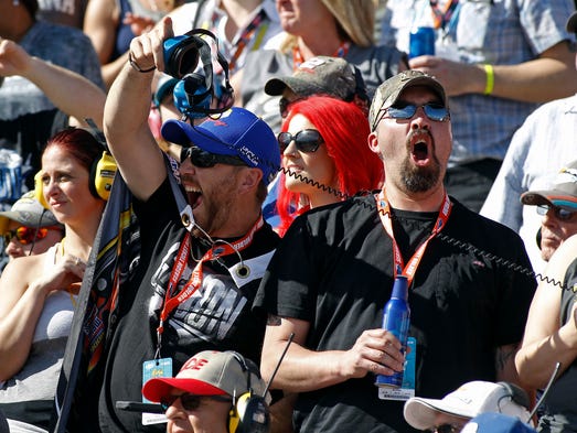 Race fans cheer on their drivers during the NASCAR