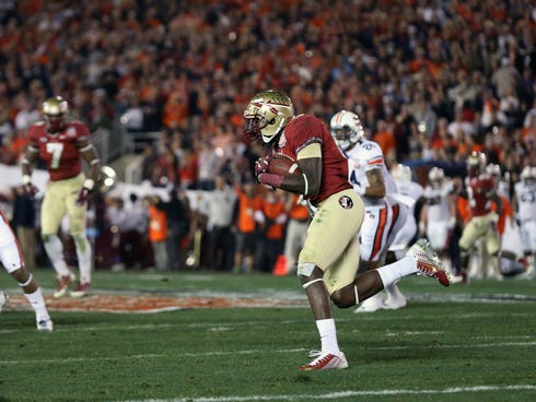 Florida State's Karlos Williams carries the ball on a fake punt in the second quarter of the BCS championship game.