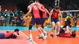 USA men's volleyball players celebrate winning the