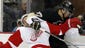 Sept. 16: Penguins center Sidney Crosby, right, and Red Wings forward Luke Glendening fight for possession during the second period in Pittsburgh. Detroit won 4-1.