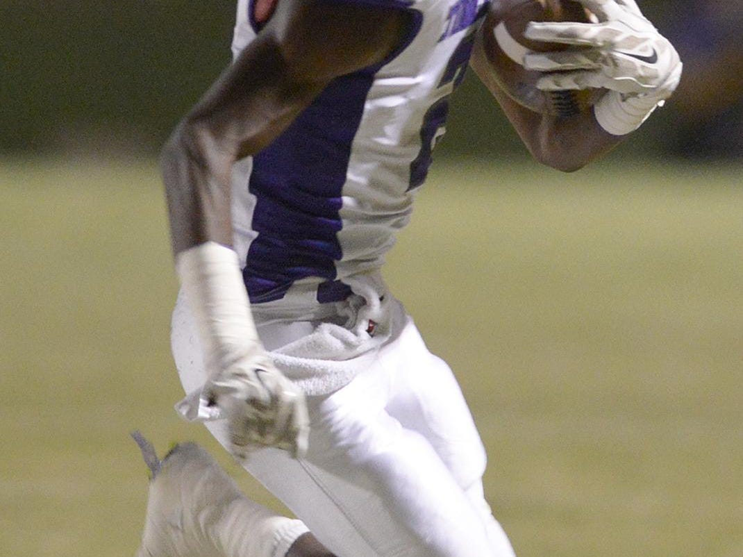 Haywood's Kris Johnson carries against Crockett County at Crockett County High School on Friday. in Alamo.