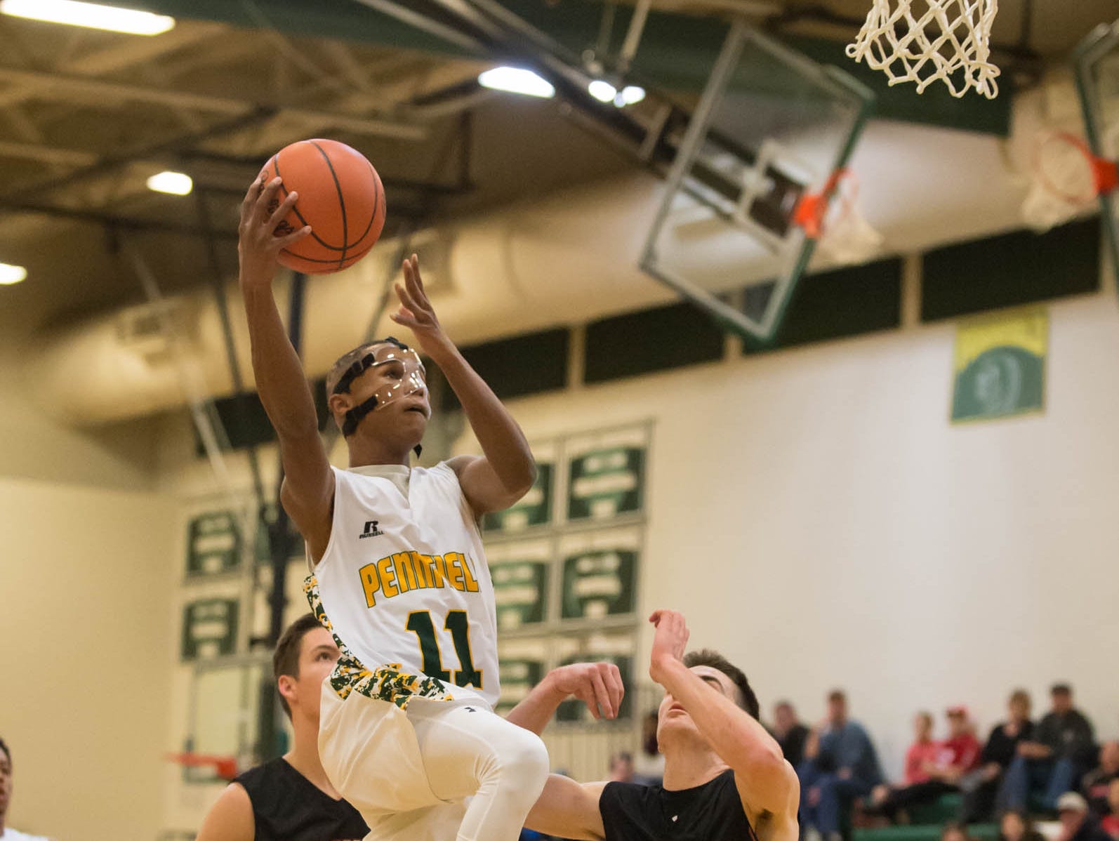 Pennfield's Francois Jamierson (11) goes for the hoop during Friday night's game.