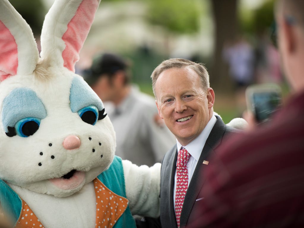 White House press secretary Sean Spicer poses for a photo with the Easter Bunny at the 139th White House Easter Egg Roll.