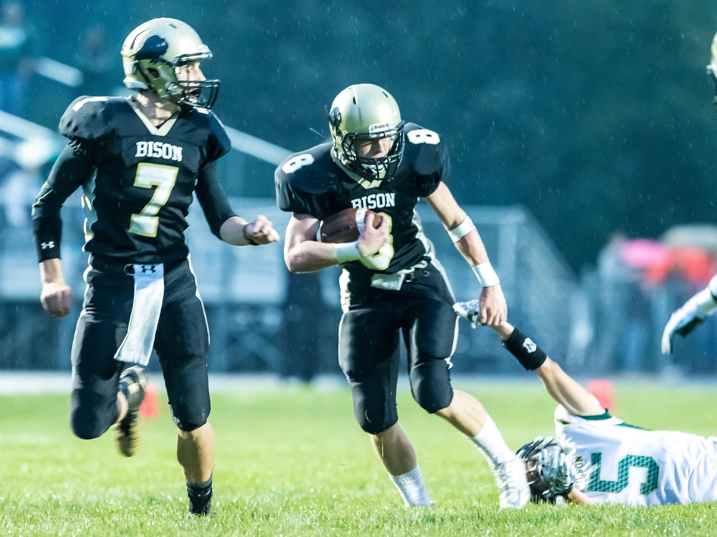 Buffalo Gap’s Austin Comer pulls from the grasp of Wilson Memorial’s Kyle Coombe during their game Friday.
