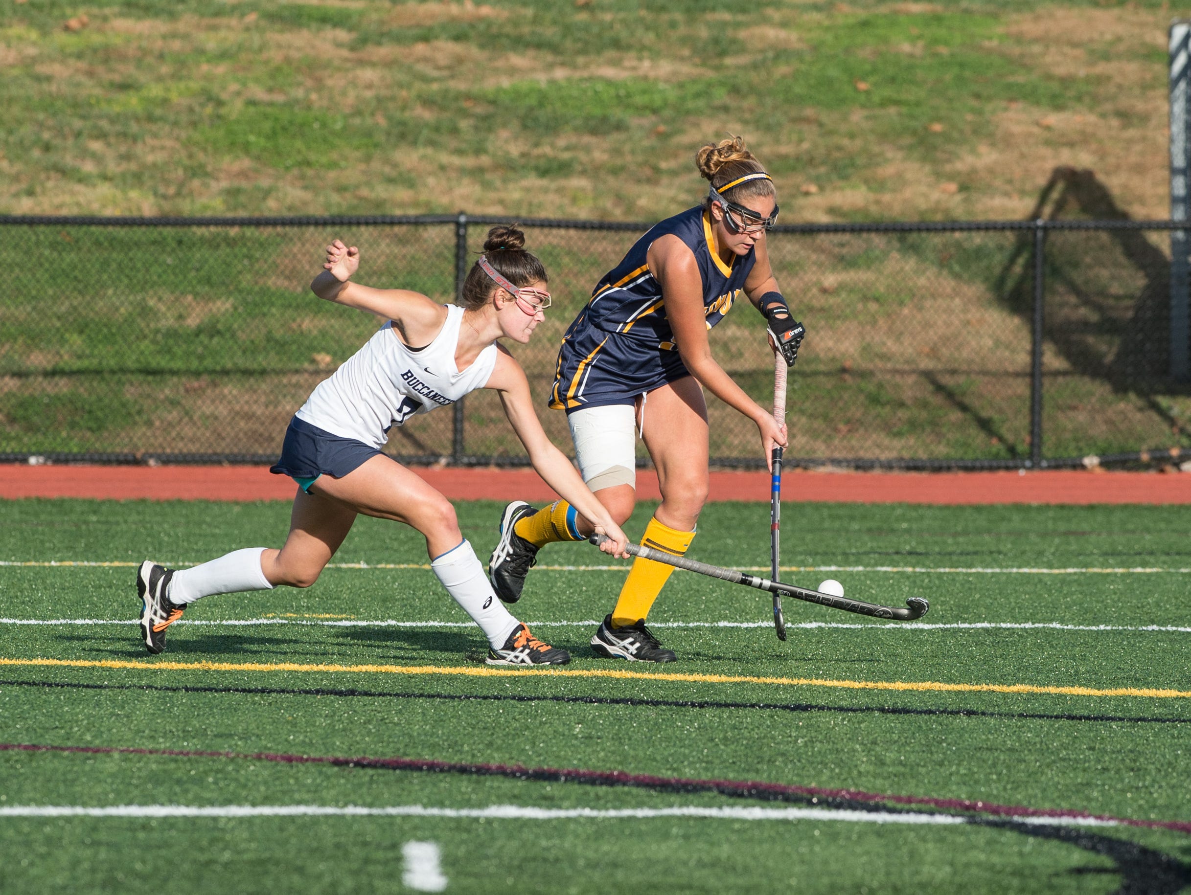 Pocomoke's Dani Batze moves the ball around Kent Island's Nina Cifollili.