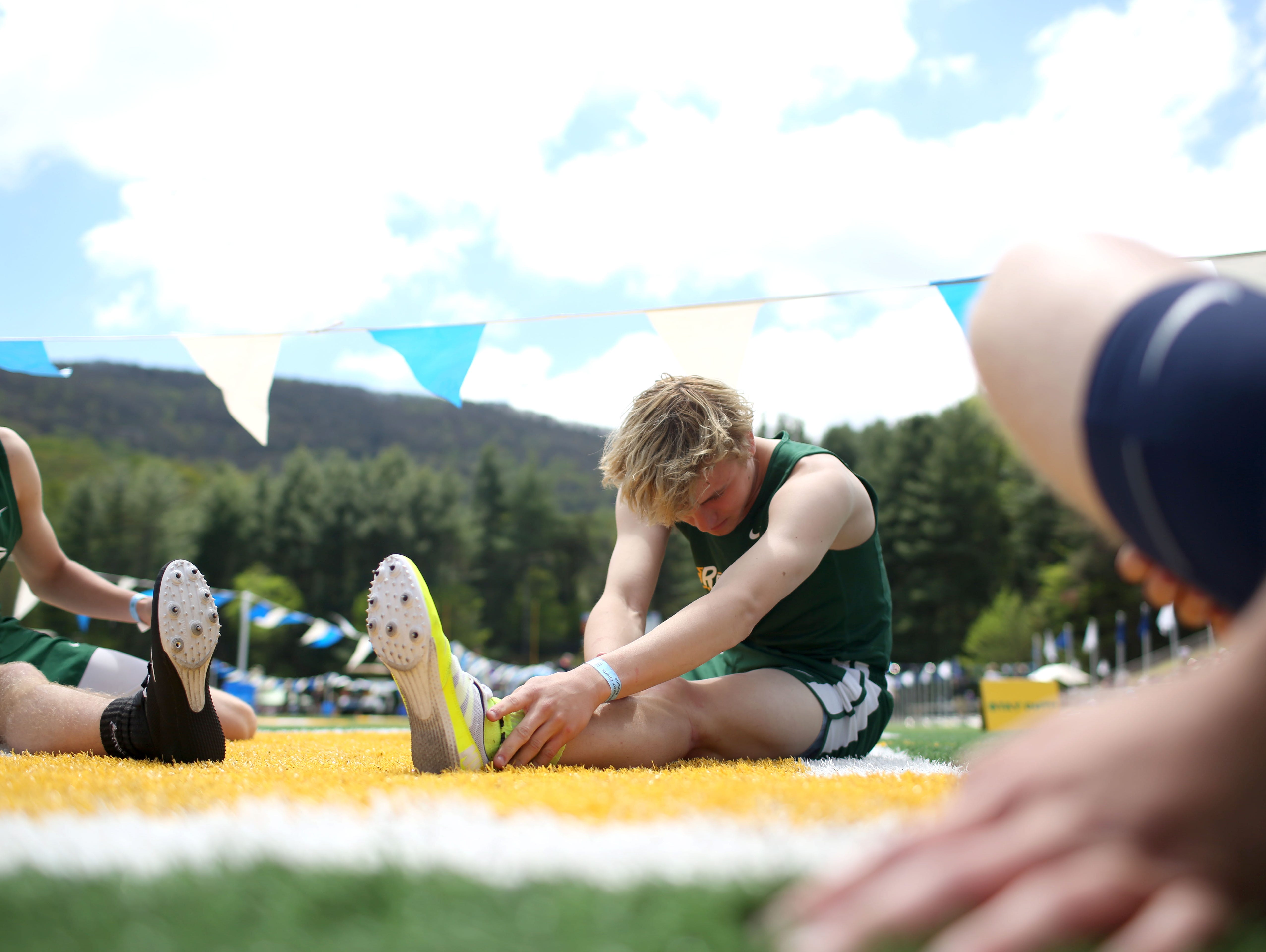 Athletes stretch before a race at last month's Blue Ridge Classic.