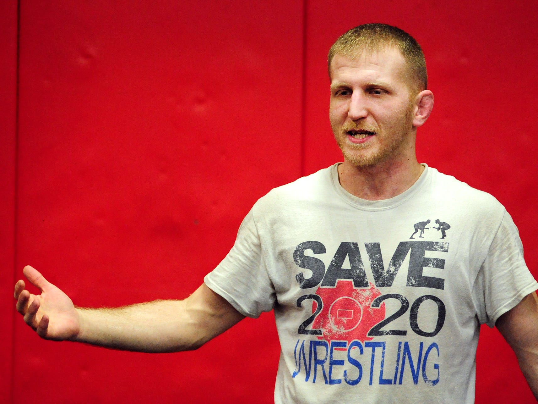 North Salem head wrestling coach Andy Pickett talks to his team during practice at the school on Monday, December 15, 2014.