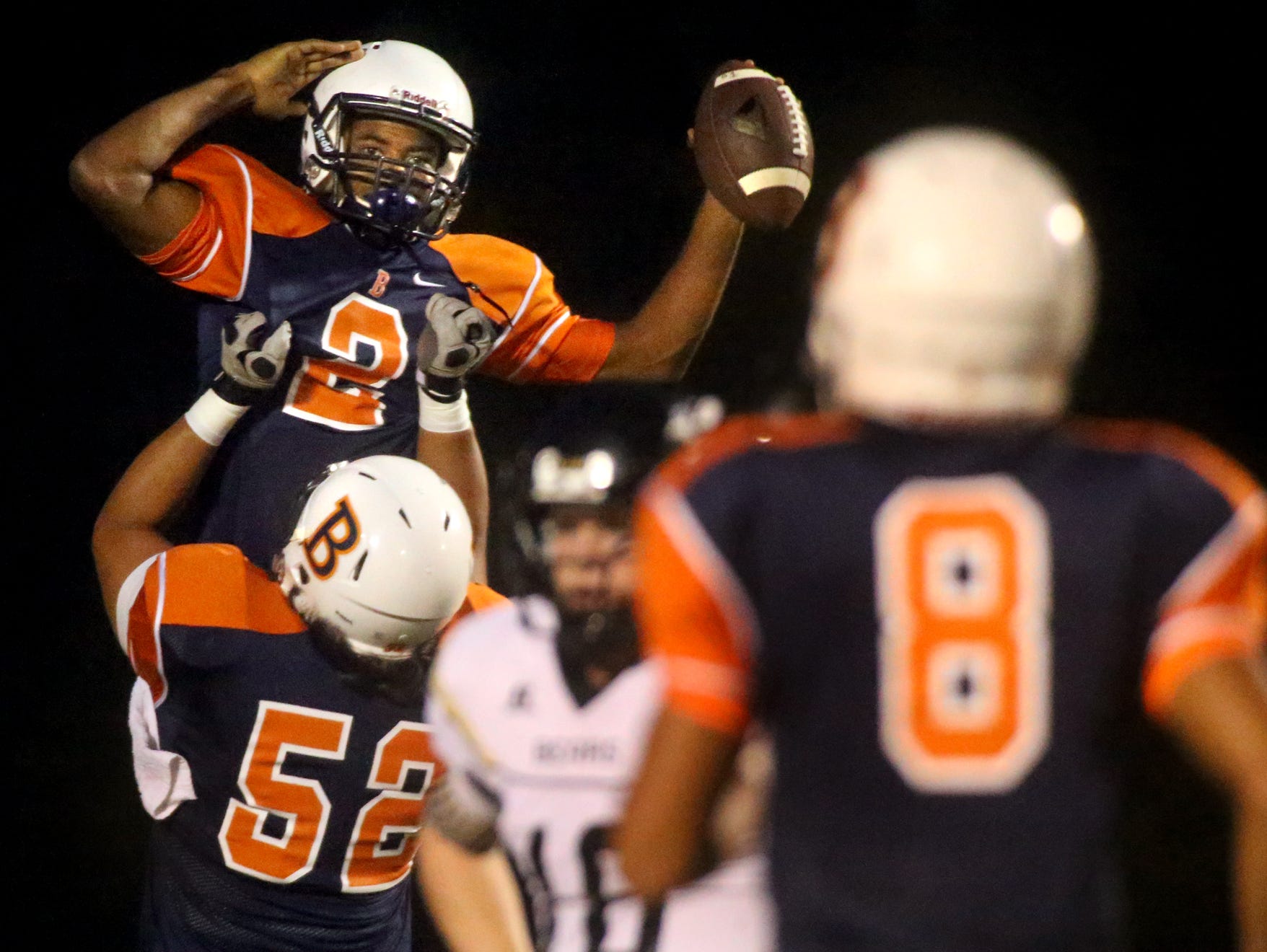 Blackman's Jauan Jennings celebrates his touchdown the second touchdown of the night, with teammate Jimmy Schwager during the game against Mt. Juliet at Blackman on Friday .