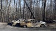 Two cars are among the massive fire damanage Tuesday,