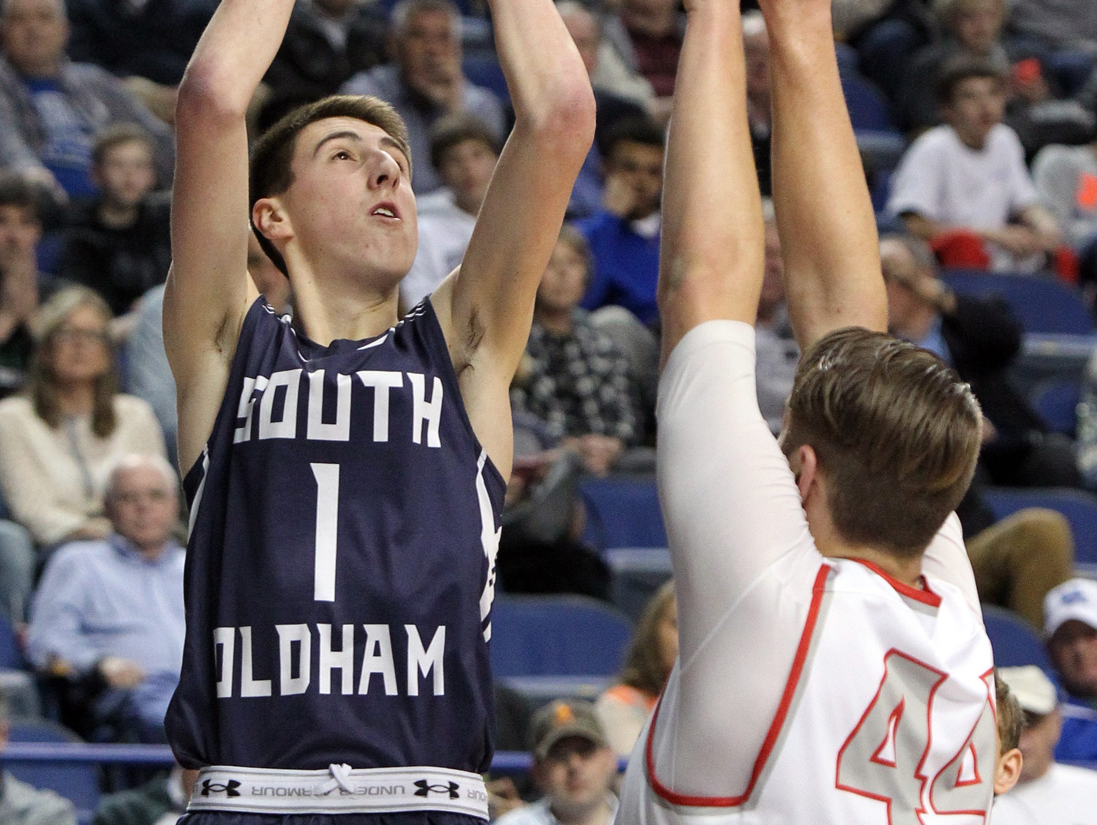 South Oldham's Devin Young shoots near South Laurel's Caleb Taylor during their quarter-final round of the Sweet 16 in Lexington. March 18, 2016