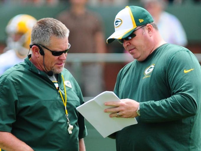 Green Bay Packers coach Mike McCarthy, right, with special teams coordinator Shawn Slocum during OTA practice at Ray Nitschke Field, Tuesday, June 10, 2014.