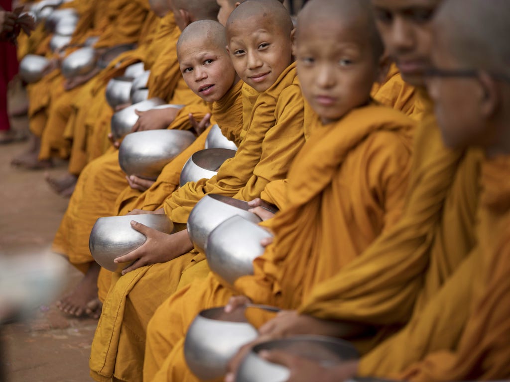 Young Buddhist monks receive donations during Buddha's birthday prayers at Boudha Stupa in Kathmandu, Nepal. Vesak is observed during the full moon in May or June, which celebrates the stages of the life of Buddhism's founder, Gautama Buddha, from th