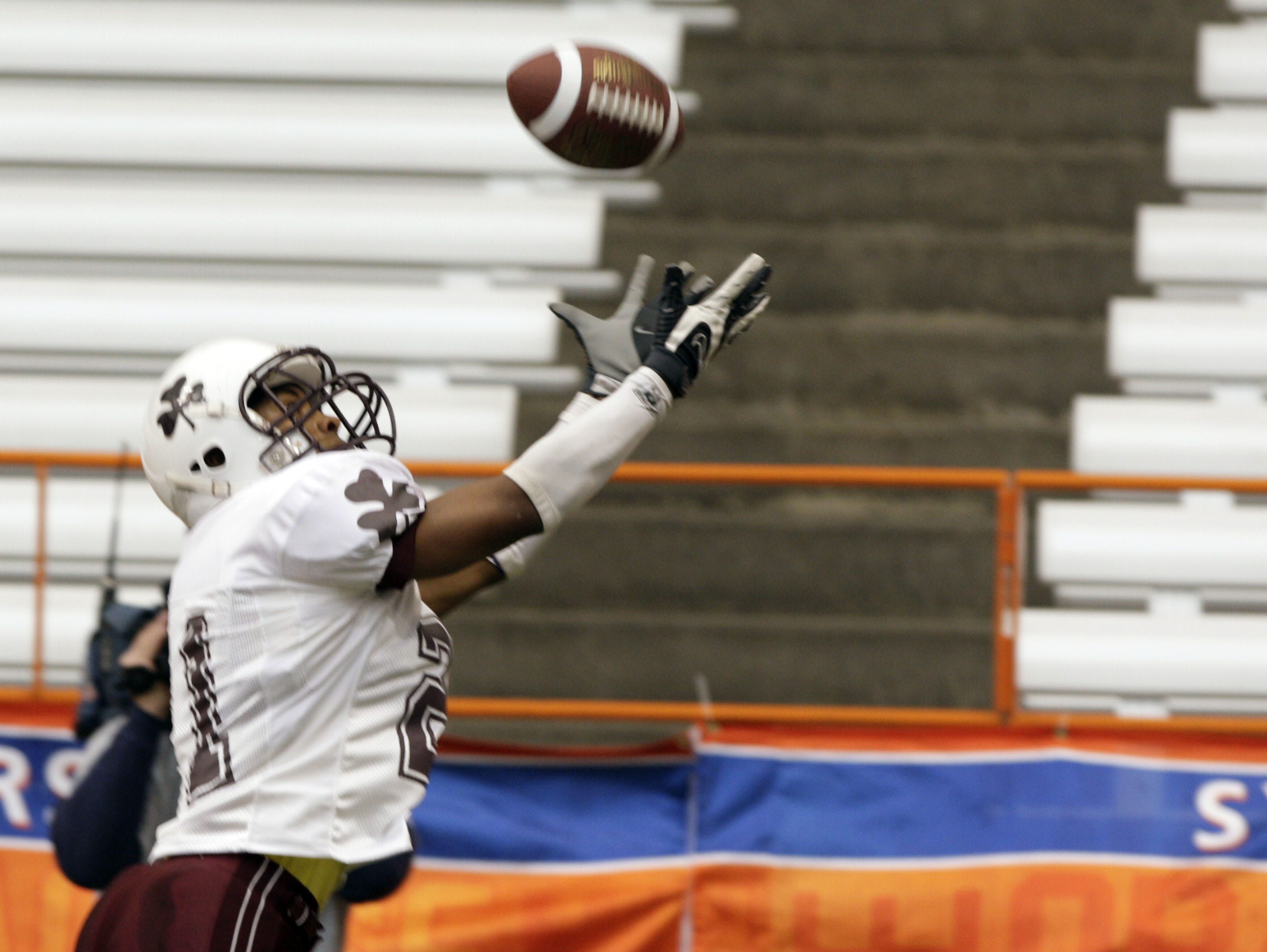 Aquinas' Dwayne Smith tries to reel in an interception during the 2007 Class A state title game between Aquinas and Lansingburgh at the Carrier Dome in Syracuse.