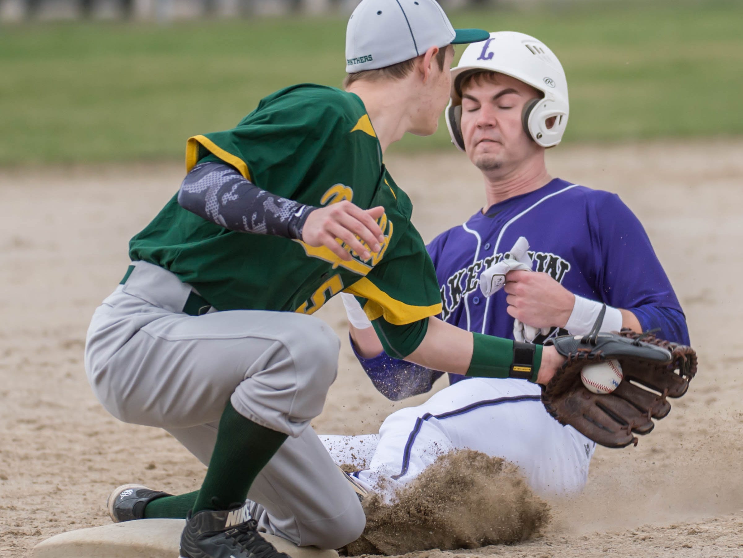 Lakeview's Skyler Nichols (14) slides into thirds during a recent game against Pennfield