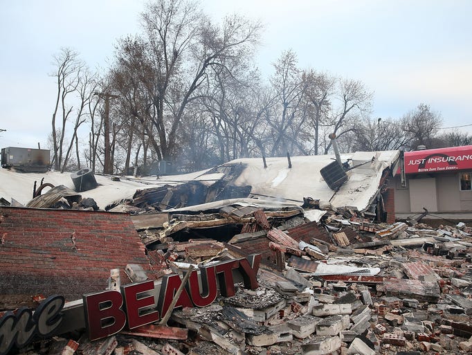 DELLWOOD, MO - NOVEMBER 25:  A sign sits amidst rubble