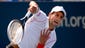 Novak Djokovic fires a serve during the first set.