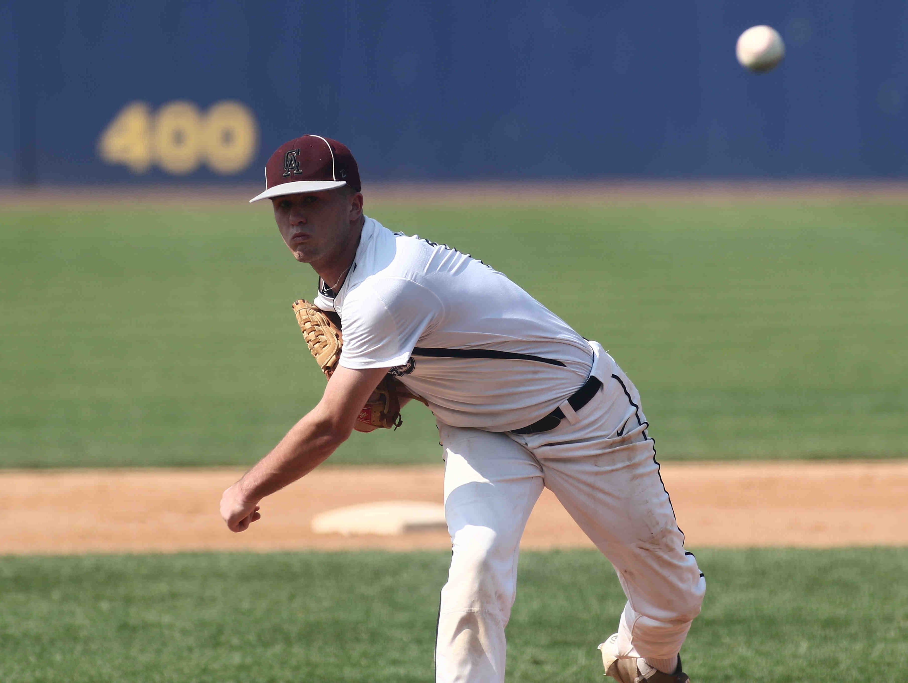Caravel pitcher Bryce Carney (13) throws a strike during a DIAA baseball semifinal game between Caravel and Middletown at Frawley Stadium on Saturday.