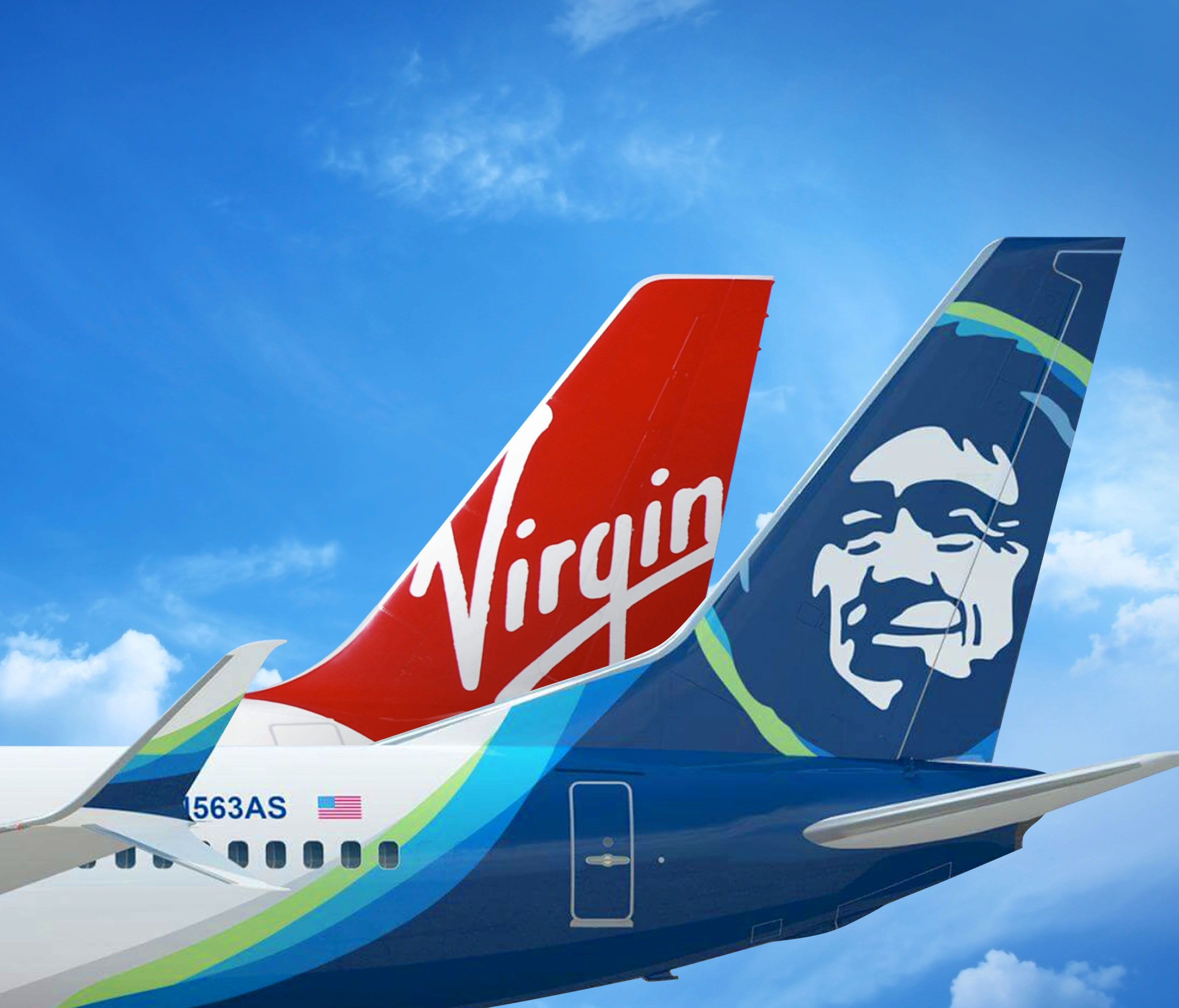 An image showing the tails of Alaska Airlines and Virgin America aircraft.