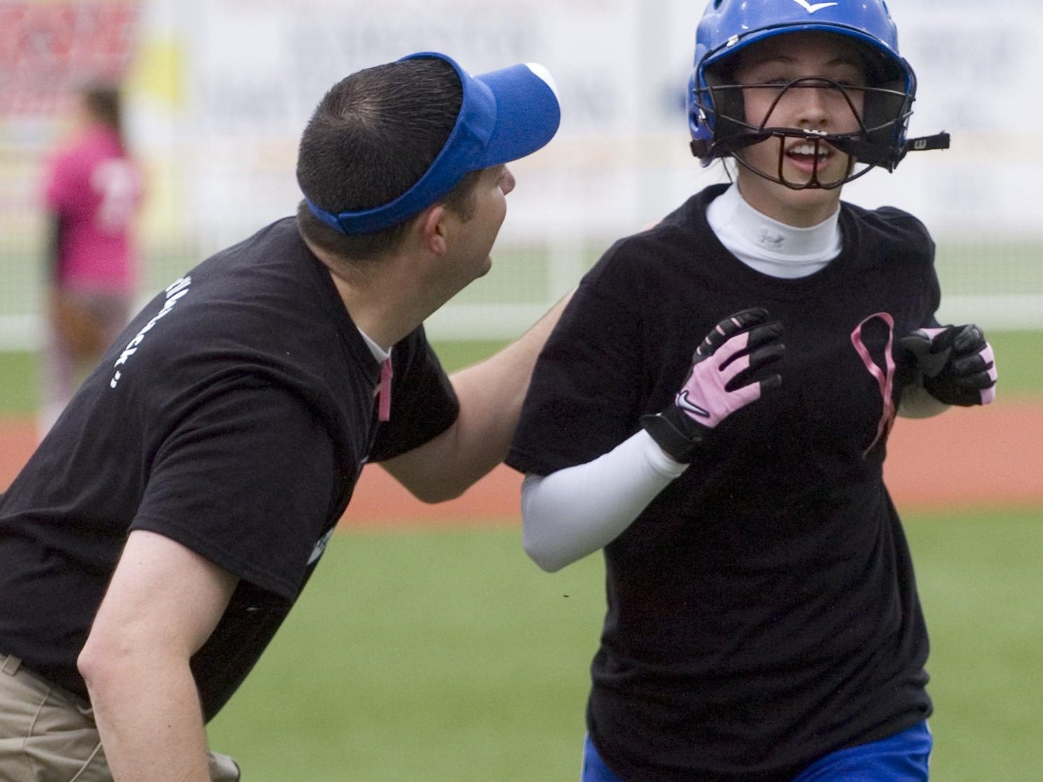 Chillicothe softball coach Greg Phillips gives words of encouragement to Maranda Bliss during a regular season game in 2009. Phillips will return as the Cavaliers’ head coach in 2016.