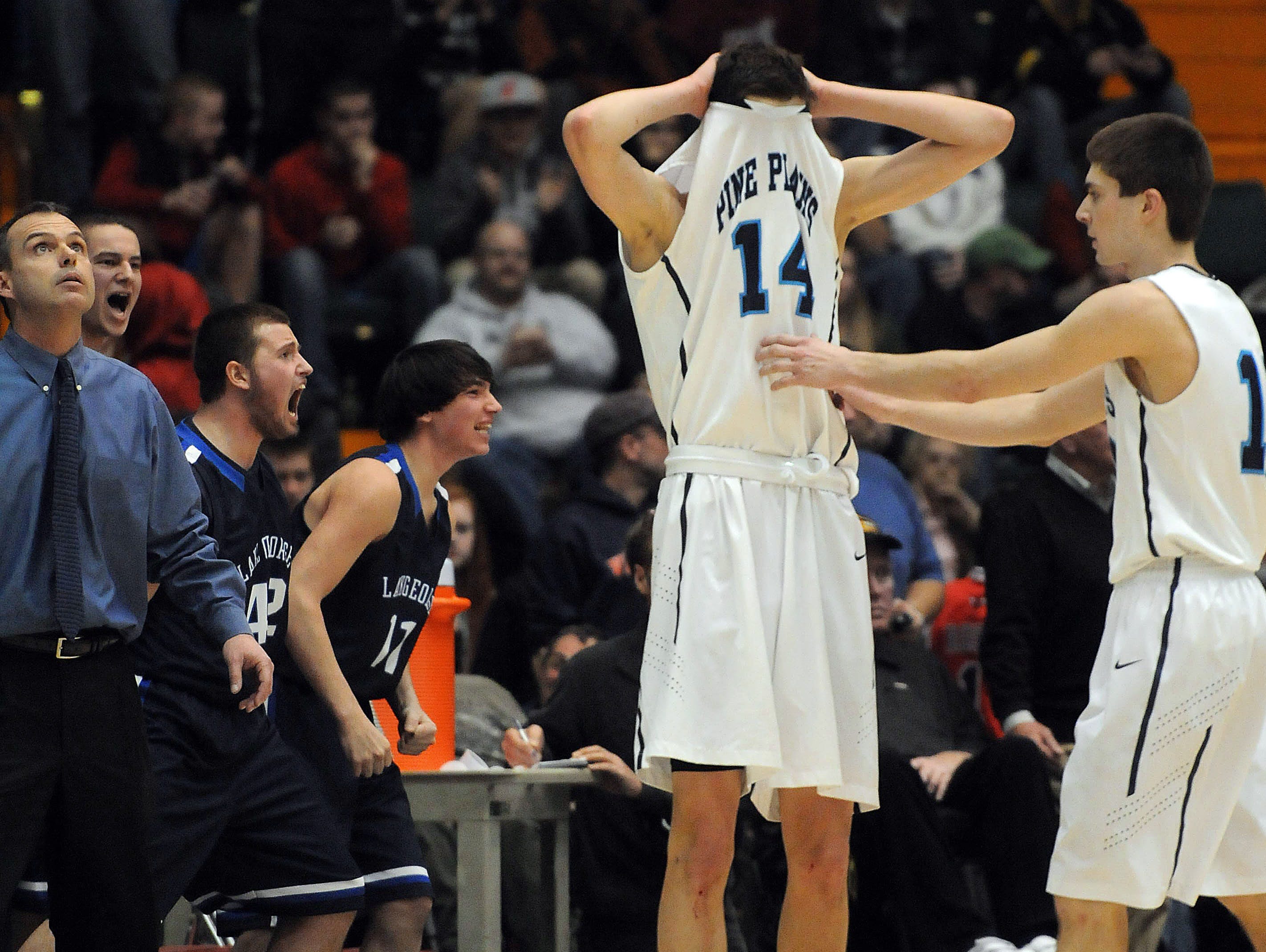 Pine Plains' Tyler Lydon, left, and Justin Cooper, react in the final minute of the game on March 16, 2013 as they trail Lake George in Glens Falls.