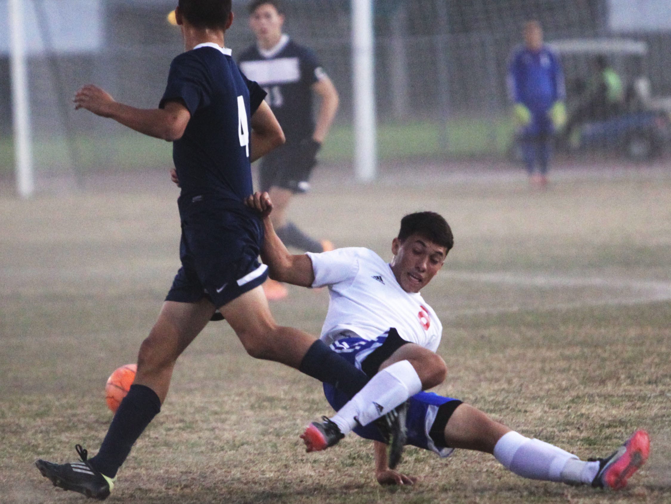 Diego Ceja, of Indio High School, goes down on a hard fought play against La Quinta High School.