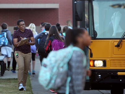 Students arrive at Houston Middle School. In the three