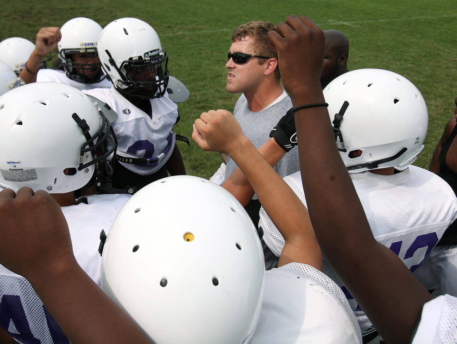 Brad Seiss guides a Central football practice in 2012. Seiss has accepted the coaching job at Merrillville after three seasons at Central.