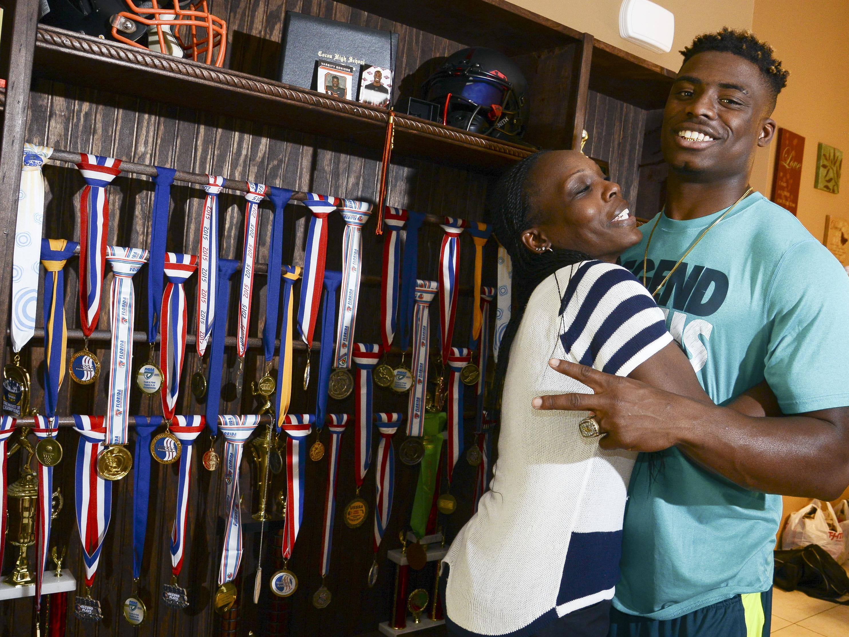 Chauncey Gardner stands with his mother Delatron Johnson in their Cocoa home.